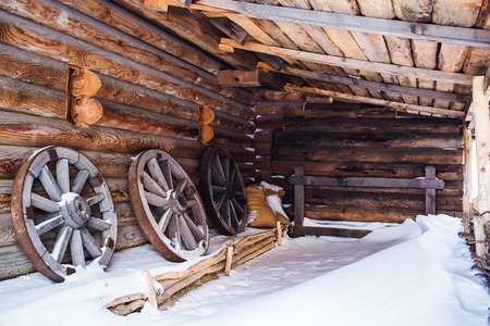 Wooden wheels with an iron rim in wooden barnの写真素材