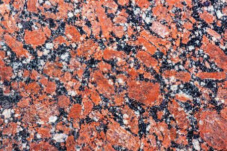 Polished granite. Real natural red granite stone texture and surface backgroundの写真素材