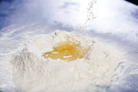 flour with egg in middle. side viewの写真素材