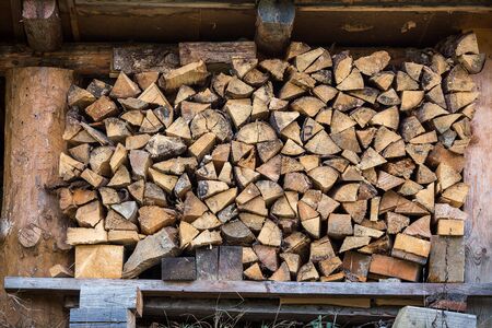 Firewood under a canopy on the street