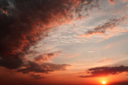 red sunset with heavy clouds. a storm is coming.