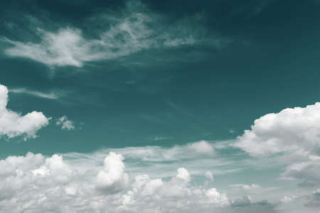 White cumulus clouds and a blue skyの写真素材