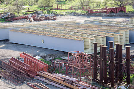 prefabricated parts of the bridge. steel welded beams and supports for bridge construction