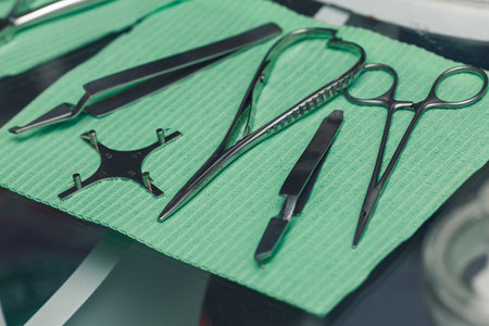 Set of dentist tools on a green background.の写真素材