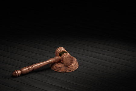 a wooden gavel with a gold clip for an auction on a stand on a wooden table. 3d rendering.の写真素材
