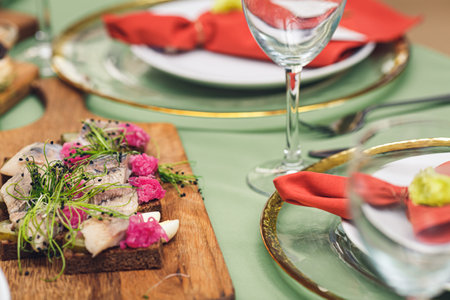 Black bread sandwich with herring and microgreens
