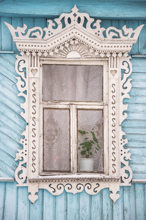 old carved window of a village houseの写真素材