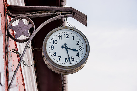 the old railway station clocks to show the timeの写真素材