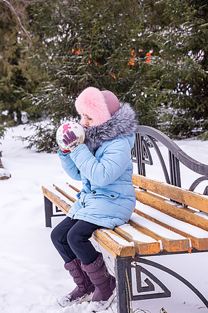 the child inflates the ball, at the festival, the wires of the Russian winterの写真素材