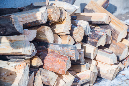 lumber, lying in the snow, a log felled in winter for firewood
