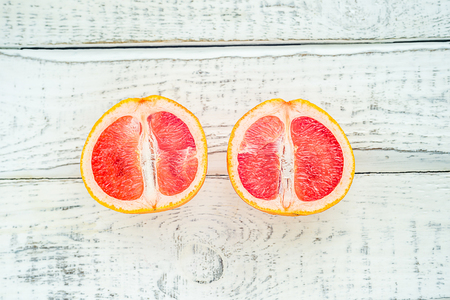 the two halves of the grapefruit, in the background , to the substrate in the Internet and print on billboardsの写真素材