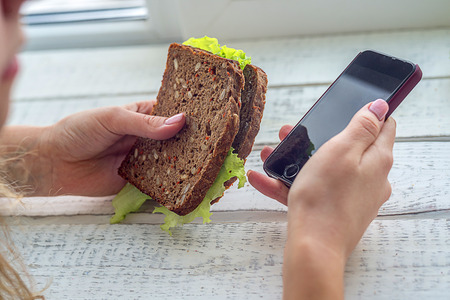 business lunch, snack ,business negotiations, with the phone in hand