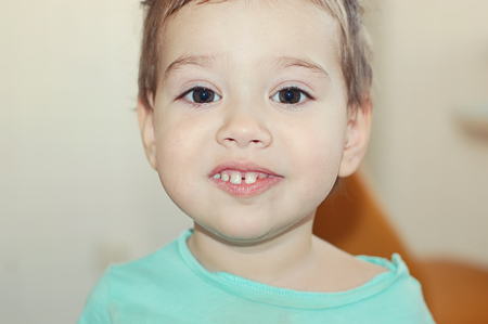 child, boy smiling portrait, close-upの写真素材