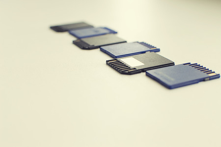 a set of flash drives lies on a white tableの写真素材