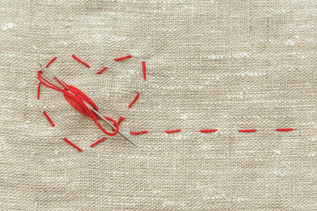 the composition of a seamstress, a tailor, a sewing thread and for knitting, a red string in the...