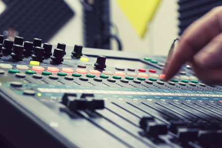 the mixer at recording studio to record music and a voice, selective focus