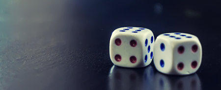 dice on a black table, concept of winningの写真素材