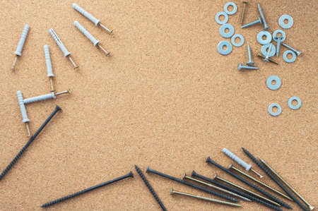 Repair. Screws and washers on the desktop. The concept of a repair shop. Close-up.の写真素材