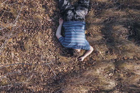 dead body the corpse of an adult homeless man found using a drone in a landfill during aerial photography to search for missing people.の写真素材