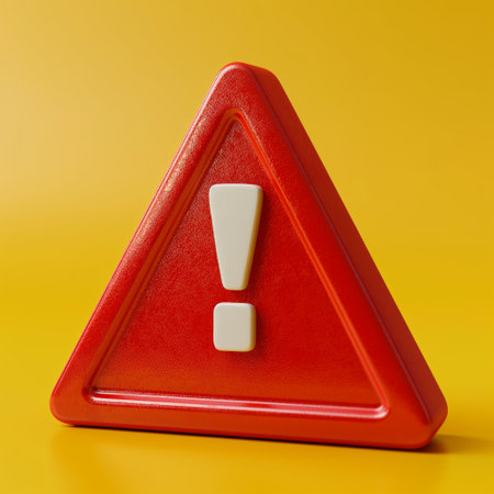 A vivid red triangular warning sign with an exclamation mark stands out against a bright yellow background.の素材