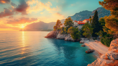 As the sun dips below the horizon, the coastal village is bathed in a warm glow, surrounded by rugged cliffs and vibrant greenery.の素材