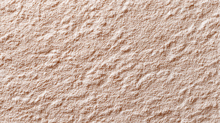 A close-up of a soft, textured surface in warm beige tones, perfect for backgrounds or artistic projects.の素材