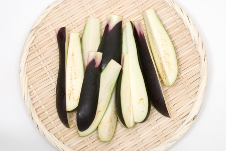 Several cut eggplant on sieveの写真素材