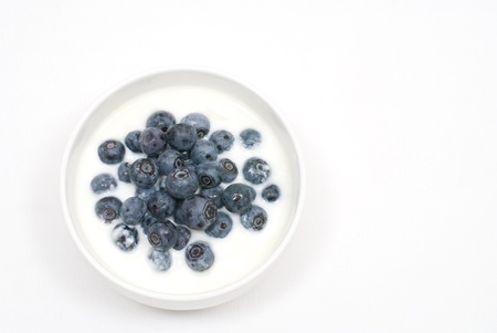 Cup of blueberries with yoghurtの写真素材