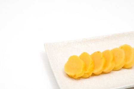 Japanese yellow pickled radish named Takuanの写真素材