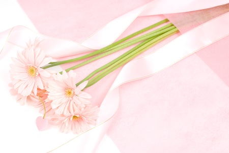 Pink gerbera daisy bouquet on the wrapping paperの写真素材