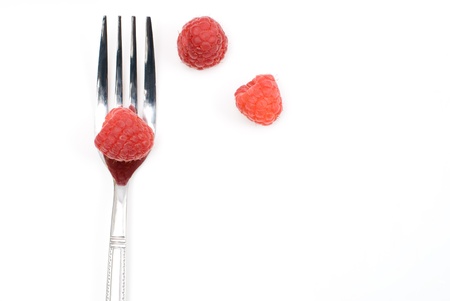 Raspberry and fork on a white backgroundの写真素材