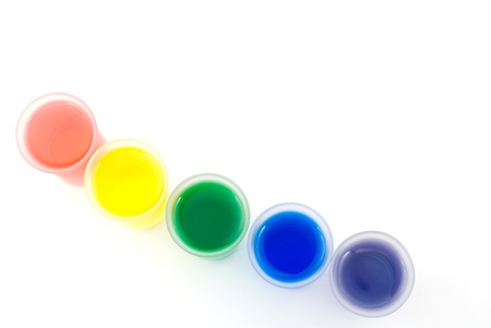 Diagonal line of five frosted glass and color water isolated on white background from overheadの写真素材