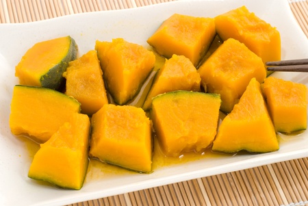 Japanese popular boiled pumpkin cuisine on the white plateの写真素材