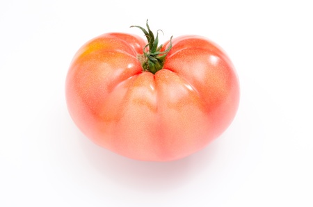 One heart shaped tomato isolated on white backgroundの写真素材