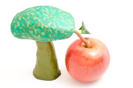 Red apple become a clay tree set isolated on white backgroundの写真素材