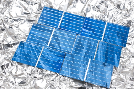 Six solar cells aligned on the aluminum foilの写真素材