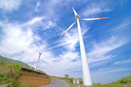Close up wind power plant under blue sky