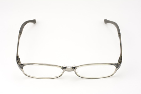 Plastic frame glasses facing front on a light gray background