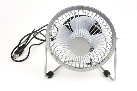 Small electric fan isolated on white background