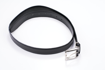 Black male belt rolled up isolated on white background