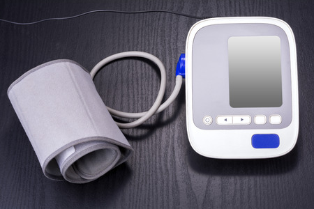 Electronic sphygmomanometer for household use on black table