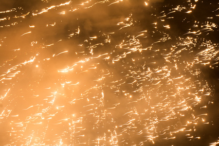 Light spot of bursting fireworks going to the upper rightの写真素材