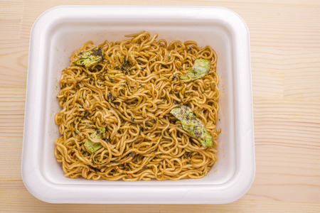 Soak a fried noodles in hot water that after mix a source called Cup Yakisobaの写真素材