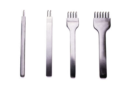 Lined four kinds of stitching chisels on a white backgroundの写真素材