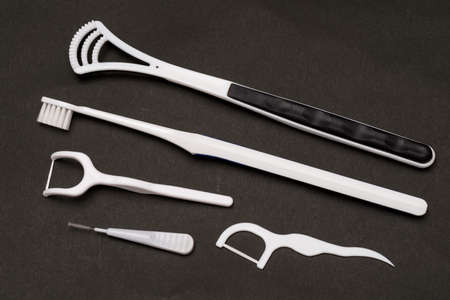 5 types of oral care products on a dark backgroundの写真素材