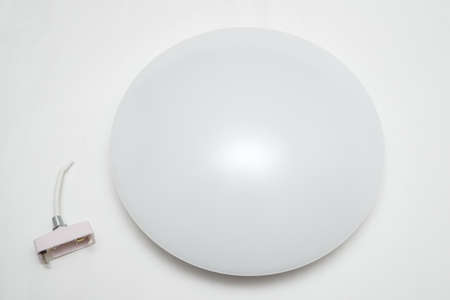 Circular LED ceiling light on a gray backgroundの写真素材