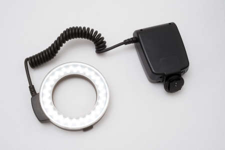 LED ring light with battery pack on a gray backgroundの写真素材
