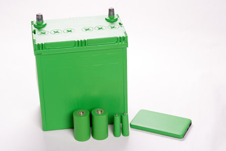 Various green batteries on light gray backgroundの写真素材