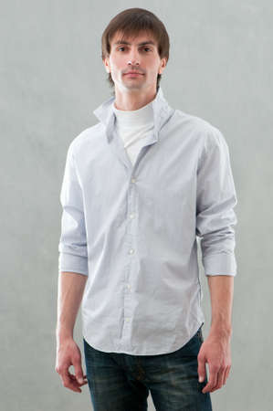 handsome man standing in studioの写真素材