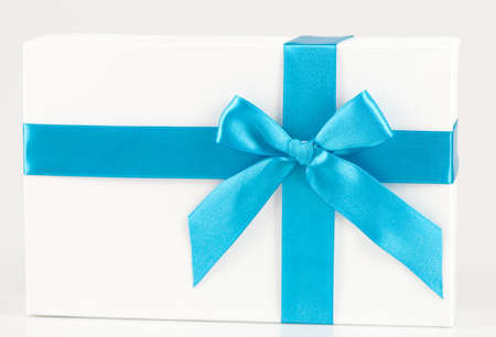 box with blue ribbon on whiteの写真素材